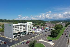 an aerial view of a city with a highway at Holiday Inn & Suites Pigeon Forge Convention Center, an IHG Hotel in Pigeon Forge