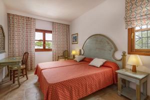 Postel nebo postele na pokoji v ubytování Villa Cala dor + 35 fotografií