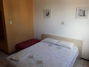 Ένα ή περισσότερα κρεβάτια σε δωμάτιο στο Silva Hospedagem FLAT BELLAGIO BEIRA MAR