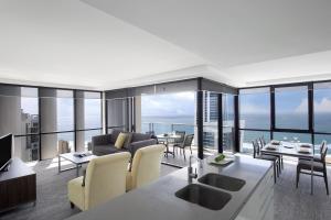 a hotel room with a large window overlooking the ocean at Mantra Circle On Cavill in Gold Coast