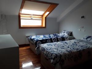 Ліжко або ліжка в номері Duplex santa cruz