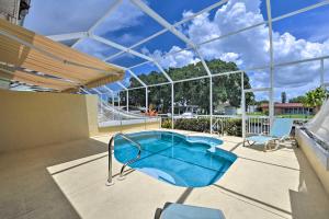 a swimming pool in the middle of a house at Pool and Boat Dock! Waterfront Cape Coral Townhome in Cape Coral