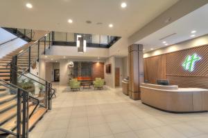 a lobby of a hospital with a waiting room at Holiday Inn & Suites Pigeon Forge Convention Center, an IHG Hotel in Pigeon Forge