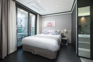 Ein Bett oder Betten in einem Zimmer der Unterkunft Utop Boutique Hotel&Residence