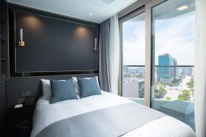 Ein Bett oder Betten in einem Zimmer der Unterkunft Utop Boutique Hotel&Residence