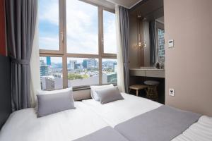 Ein Bett oder Betten in einem Zimmer der Unterkunft Utop Boutique Hotel&Residence