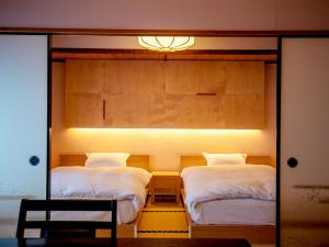 Letto o letti in una camera di Wakamatsu HakoneYugawara