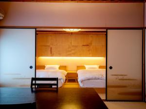 Letto o letti in una camera di Wakamatsu HakoneYugawara