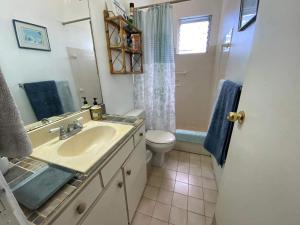 a bathroom with a sink and a toilet at Villa 46 in Saint James