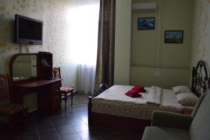 Postel nebo postele na pokoji v ubytování Voskhod Hotel