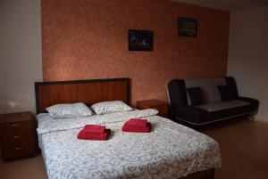 Postel nebo postele na pokoji v ubytování Voskhod Hotel