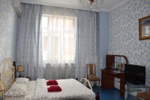 Postel nebo postele na pokoji v ubytování Voskhod Hotel