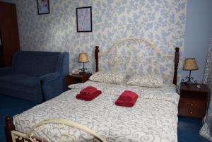 Postel nebo postele na pokoji v ubytování Voskhod Hotel