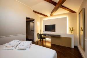 Hotel Villa Soligo - Small Luxury Hotels of the World客房内的一张或多张床位