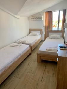 Кровать или кровати в номере Guesthouse Vila Tamburic