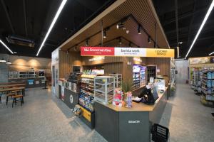 a grocery store with a counter in the middle at Utop Boutique Hotel&Residence in Gwangju