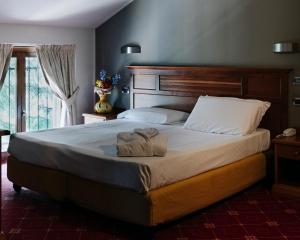 a bedroom with a large bed with towels on it at La Pina in Rezzato +72 photos