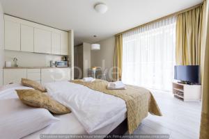 Łóżko lub łóżka w pokoju w obiekcie Apartament Czarna Góra Sienna SOL