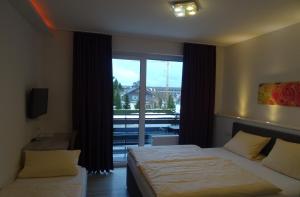 Postel nebo postele na pokoji v ubytování Aktiv Hotel Winterberg
