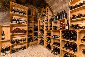 a wine cellar filled with lots of wine bottles at Hostellerie Le Petit Manoir in Morges