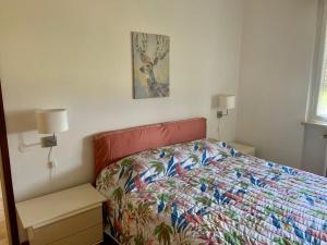 Posteľ alebo postele v izbe v ubytovaní Valeriana Vacanze