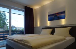 Postel nebo postele na pokoji v ubytování Aktiv Hotel Winterberg