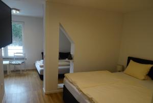 Postel nebo postele na pokoji v ubytování Aktiv Hotel Winterberg