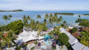 an aerial view of a resort with a pool and the ocean at La Vida Samui in Chaweng