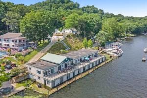 an aerial view of a house on the water at Waterside Suites in Saugatuck