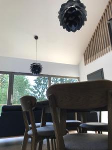 a dining room with a table and chairs at Rudle in Świerkocin +49 photos
