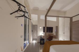 Postel nebo postele na pokoji v ubytování METEORON Luxury Rooms