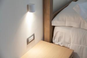 Postel nebo postele na pokoji v ubytování METEORON Luxury Rooms
