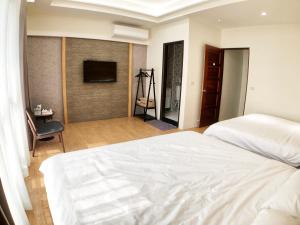 Posteľ alebo postele v izbe v ubytovaní Alishan Zhuqi Homestay #57