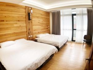 Posteľ alebo postele v izbe v ubytovaní Alishan Zhuqi Homestay #57