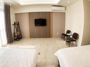 Posteľ alebo postele v izbe v ubytovaní Alishan Zhuqi Homestay #57