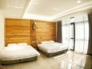 Posteľ alebo postele v izbe v ubytovaní Alishan Zhuqi Homestay #57