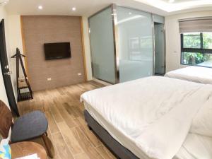 Posteľ alebo postele v izbe v ubytovaní Alishan Zhuqi Homestay #57