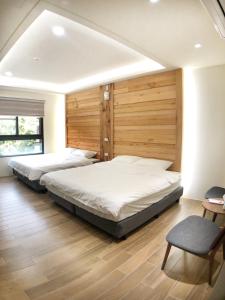 Posteľ alebo postele v izbe v ubytovaní Alishan Zhuqi Homestay #57