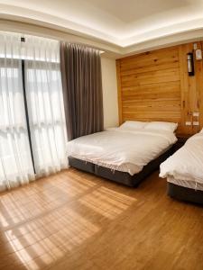 Posteľ alebo postele v izbe v ubytovaní Alishan Zhuqi Homestay #57