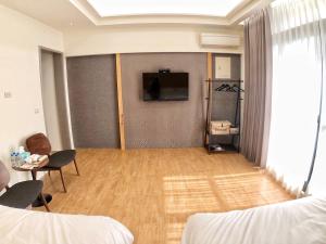 TV a/nebo společenská místnost v ubytování Alishan Zhuqi Homestay #57 + 15 fotografií