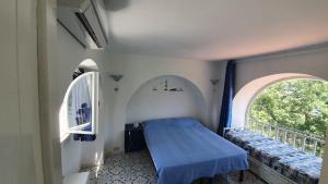 מיטה או מיטות בחדר ב-Villa Sole&Mare