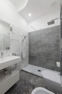 a bathroom with a toilet and a sink and a shower at La Roma di Cecilia in Rome +11 photos