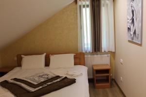 Voodi või voodid majutusasutuse Vila Madera Pribojska Banja toas