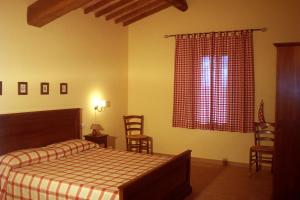 Posteľ alebo postele v izbe v ubytovaní Agriturismo Antica Cassia