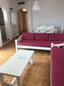 A seating area at Apartamentos Es Cañe