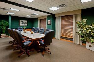 a conference room with a table and chairs at La Quinta by Wyndham Garden City in Garden City