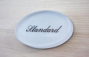 a white plate with the wordland written on it at Duomo Luxury Suite Catania in Catania