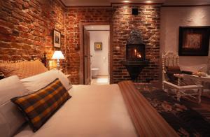 Łóżko lub łóżka w pokoju w obiekcie Paul's Fantasia Boutique Suites