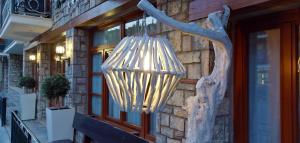 a chandelier hanging from the side of a building at Boutique Hotel Parnassia in Arachova