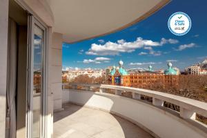 a view of the city from the balcony of a building at Luzeiros Suites in Lisbon